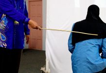 Two women were caned in front of 100 people in a shariah court in Terengganu on Sept 3 for attempting to commit lesbian sex. (Bernama pic)